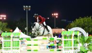 Rashid Towaim Al Marri. astride Beyonce, clears a hurdle during the second day of the Al Rayyan International Show Jumping Championship at the Qatar Equestrian Federation's (QEF) Main Arena yesterday. Pictures by Lotfi Garsi
