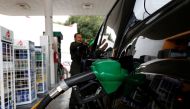 A car is being filled with fuel at a Pemex gas station in Mexico City, Mexico, December 30, 2016. REUTERS/Carlos Jasso
