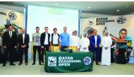 Players taking part in the Qatar ExxonMobil Open, pose for a picture with officials of Qatar Tennis Federation after the draw ceremony.  