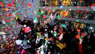 Revelers celebrate as confetti falls just after midnight during New Year celebrations in Times Square in New York, January 1, 2017. REUTERS/Mark Kauzlarich
