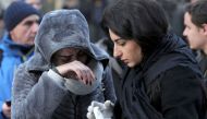 Women who survived an attack by a gunman, react outisde the Reina nightclub by the Bosphorus, in Istanbul, Turkey, January 1, 2017. REUTERS/Huseyin Aldemir
