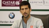 Novak Djokovic of Serbia attends a press conference during the ATP Qatar Open tennis competition in Doha on January 1, 2017. / AFP / KARIM JAAFAR
