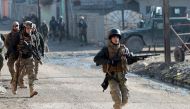 Iraqi forces patrol the Al-Intisar area in eastern Mosul after recapturing it in an ongoing military operation against Islamic State (IS) group jihadists, on January 1, 2017. AFP / AHMAD AL-RUBAYE

