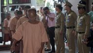 Suspects facing human trafficking charges arrive at the criminal court in Bangkok on November 10, 2015 (AFP / Pornchai Kittiwongsakul) 