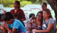 Relatives of prisoners await news after a bloody prison riot Monday in the Amazon jungle city of Manaus, Brazil. Michael Dantas / Reuters.