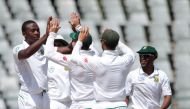 South African bowler Kagiso Rabada (L) celebrates the dismissal of Sri Lanka batsman Dinesh Chandimal (not in picture) during the second Test between South Africa and Sri Lanka on January 5, 2017 at Newlands Cricket Stadium in Cape Town. (AFP / GIANLUIGI 
