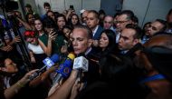 Venezuela's opposition leader Manuel Rosales (C) talks with the press after leaving the court in Caracas in January 4, 2017. Venezuelan President Nicolas Maduro on Saturday released six dissidents, among them former presidential candidate Manuel Rosales, 