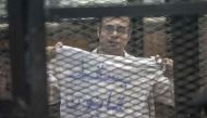 (FILES) This file photo taken in Cairo on December 08, 2013 shows political activist and coordinator of the April 6 Movement, Ahmed Maher, during his trial over an unlicensed and violent demonstration. AFP / MAHMOUD KHALED
