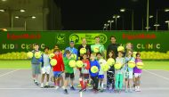 World no. 1 men’s doubles team Jamie Murray and Bruno Soares pose for a photograph with children from the ExxonMobil Qatar community during a coaching clinic in Doha.