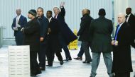 US President-elect Donald Trump along with others exits One World Trade Center in Manhattan, New York City, yesterday.