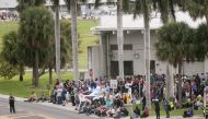 Passengers who were at Fort Lauderdale International Airport during Friday’s shooting were rounded up and not allowed to leave until police could confirm they had nothing to do with the shooting on January 06, 2017 in Florida, USA. ( Carlos Miller - Anado