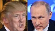 (COMBO) This combination of pictures created on December 30, 2016 shows a file photo taken on December 28, 2016 of US President-elect Donald Trump (L) in Palm Beach, Florida; and a file photo taken on December 23, 2016, of Russian President Vladimir Putin