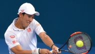 Japan’s Kei Nishikori hits a shot during his match against Switzerland’s Stan Wawrinka. REUTERS/Steve Holland
