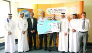 The winners of the ship & win draw from CONNECTED by Qatar Post with officials.
