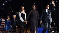 US First Lady Michelle Obama (2R) and US President Barack Obama greet supporters as daughter Malia looks on after the President delivered his farewell address in Chicago, Illinois on January 10, 2017. AFP / Nicholas Kamm