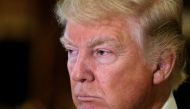 File Photo: U.S. President-elect Donald Trump listens to questions from reporters in the lobby at Trump Tower in New York, U.S., January 9, 2017. REUTERS/Mike Segar/File Photo
