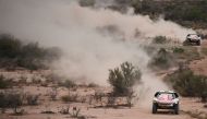 Peugeot's driver Stephane Peterhansel and his co-driver Jean Paul Cottret of France ride ahead of Peugeot's French driver Sebastien Loeb and co-driver Daniel Elena from Monaco during Stage 11 of the 2017 Dakar Rally between San Juan and Rio Cuarto, in Arg