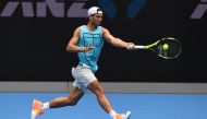 Rafael Nadal of Spain hits a return during a practice session ahead of the Australian Open tennis tournament in Melbourne on January 15, 2017. AFP / WILLIAM WEST