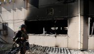 A member of Iraqi Special Operations Forces (ISOF) walks past a building of the University of Mosul during a battle with Islamic State militants, in Mosul, Iraq, January 14, 2017. REUTERS/Ahmed Saad
