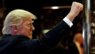 FILE PHOTO: U.S.President-elect Donald Trump gestures to people in the lobby after speaking to the news media at Trump Tower in New York, U.S., January 13, 2017. REUTERS/Shannon Stapleton/File photo
