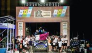 Qatari rally driver Mohammed Abu Issa (right) and his co-driver Xavier Panseri celebrate during the presentation ceremony after finishing 10th overall in the 2017 Rally Dakar in Buenos Aires, Argentina on Saturday.