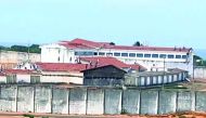 A television image of the Alcacuz Penitentiary Center near Natal, Rio Grande do Norte state, northeastern Brazil shows inmates throwing objects from the prison roof during a riot, yesterday.