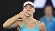 Germany's Angelique Kerber celebrates her victory against Ukraine's Lesia Tsurenko during their women's singles match on day one of the Australian Open tennis tournament in Melbourne on January 16, 2017.  AFP / PETER PARKS