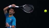 Serbia's Novak Djokovic hits a shot during a training session ahead of the Australian Open tennis tournament, in Melbourne, Australia January 15, 2017. REUTERS/Issei Kato
