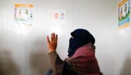 (File photo) A displaced woman who was rescued after being kidnapped by Islamic State militants, gestures at Khazer camp, Iraq, December 20, 2016. REUTERS/Ammar Awad