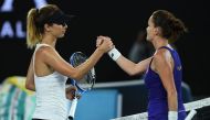 Poland's Agnieszka Radwanska (R) shakes hands with Bulgaria's Tsvetana Pironkova after victory during their women's singles match on day two of the Australian Open tennis tournament in Melbourne on January 17, 2017.   AFP / GREG WOOD