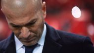 Real Madrid's French head coach Zinedine Zidane looks down before the Spanish league football match Sevilla FC vs Real Madrid CF at the Ramon Sanchez Pizjuan stadium in Sevilla on January 15, 2017. / AFP / JORGE GUERRERO
