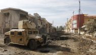 A military vehicle of Iraqi Counter-Terrorism Service (CTS) forces is seen at the site of car bomb attack during a battle with Islamic State militants in Andalus neighborhood of Mosul, Iraq, January 17, 2017. REUTERS/Alaa Al-Marjani
