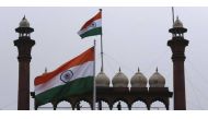 Indian Army soldiers stand guard on the balcony of the historic Red Fort as Indian national flags fly during Independence Day celebrations in Delhi August 15, 2013. REUTERS/Adnan Abidi.