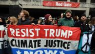 Demonstrators shout slogans against US President-elect Donald Trump in Washington, DC, on January 20, 2107. Donald Trump will be sworn in as the 45th president of the United States Friday -- capping his improbable journey to the White House and beginning 