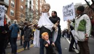 Demonstrators protest against US President-elect Donald Trump in Washington, DC, on January 20, 2107.  Donald Trump will be sworn in as the 45th president of the United States Friday -- capping his improbable journey to the White House and beginning a fou