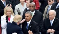 President-elect Donald Trump(L) is greeted by US President Barack Obama as he arrives on the platform at the US Capitol in Washington, DC, on January 20, 2017, before his swearing-in ceremony to be the 45th president of the US. / AFP / Paul J. Richards