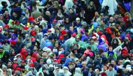 Supporters in rain gear gather in front of US Capitol, at the inauguration of President Donald Trump.