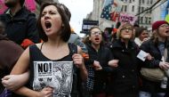 Anti-Trump protesters chant during a demonstration on January 20, 2017 in Washington, DC. Mario Tama/AFP
