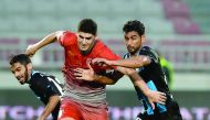 Karim Boudaif (centre) of Lekhwiya controls the ball against two Al Wakrah players during their Qatar Stars League match played at Abdullah Bin Khalifah Stadium yesterday. Lekhwiya rallied from a three-goal deficit to draw with league strugglers Al Wakrah