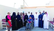 Representatives of HMC, the Community Police, Human Rights Departments and Qatar Building Company with a Bayt Aman guest.