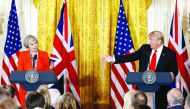 British Prime Minister Theresa May and US President Donald Trump speak during their joint news conference at the White House in Washington, yesterday.