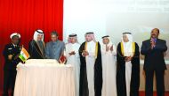 H E Mohammed bin Abdullah Al Rumaihi (second left), Minister of Municipality and Environment, and Ambassador of India P Kumaran (third left), cutting a cake at a reception hosted by the envoy to mark the 68th Republic Day of India at Doha Sheraton. Ambass
