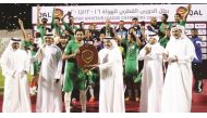 Hani Balan, Executive Committee Member of the QFA giving away the trophy to Al Waab captain at Al Ahli Stadium on Friday. Fahad Thani, Director of Football Development QFA, Ibrahim Shaheen, Chairman of the QAL Organising Committee, and Sami Al Shammari, E