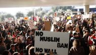 Demonstrators block traffic at the international arrival terminal as they protest against muslim immigration ban at San Francisco International Airport on January 28, 2017 in San Francisco, California. Stephen Lam/Getty Images/AFP