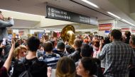 Demonstrators yell slogans during anti-Donald Trump immigration ban protests inside Terminal 4 at San Francisco International Airport in San Francisco, California, U.S., January 28, 2017. REUTERS/Kate Munsch
