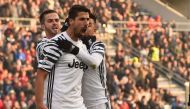 Juventus' midfielder from Germany Sami Khedira celebrates with teammates Juventus' forward from Argentina Paulo Dybala and Miralem Pjanic (L) after scoring during the Italian Serie A football match Sassuolo vs Juventus at 