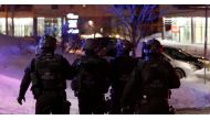 Swat team police officer walk aournd a mosque after a shooting in Quebec City, January 29, 2017. REUTERS/Mathieu Belanger
