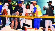 Rescue personnel and medics assist survivors at a jetty in Kota Kinabalu, sabah.