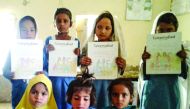 Students in Pakistan with the books that accompany Orenda's educational Taleemabad cartoon programme.