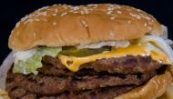 This file photo taken on August 19, 2009 shows a fast food hamburger in Washington, DC. Burgers, fries, tacos and pastries come wrapped in grease-proof paper and boxes that often contain non-stick chemicals that may be able to leach into food, US research